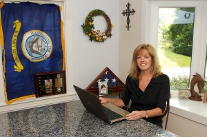 Captain Valerie Ormond, USN (Ret.) at work as an author.